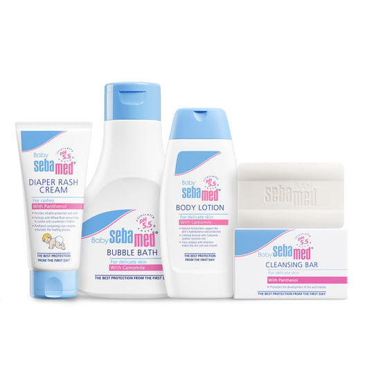 Set of Sebamed baby care products including diaper rash cream, bubble bath, body lotion, and cleansing bar on a white background.
