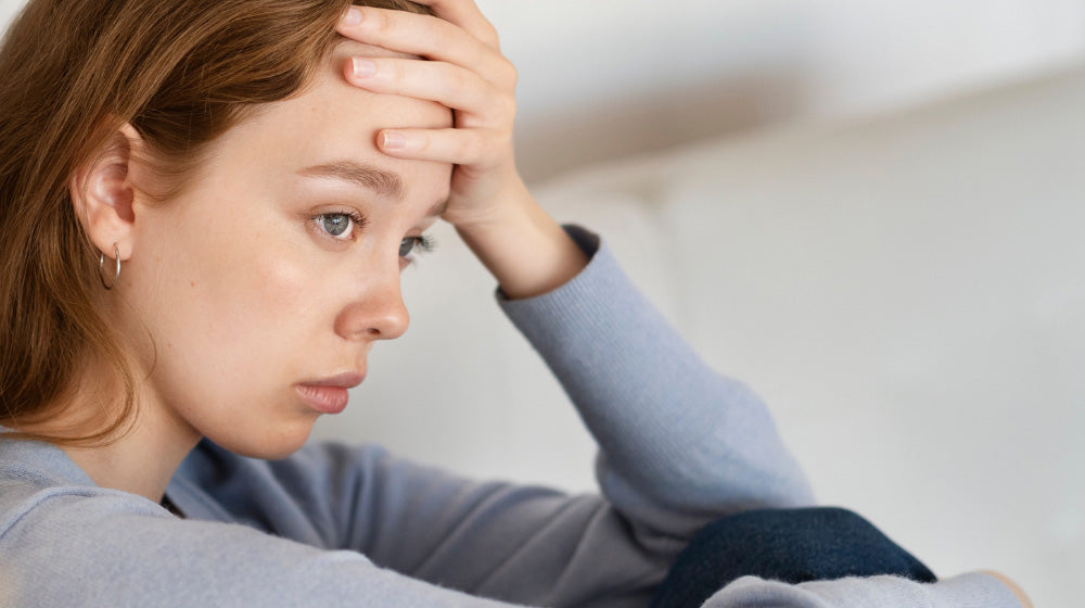 A woman looking stressed.