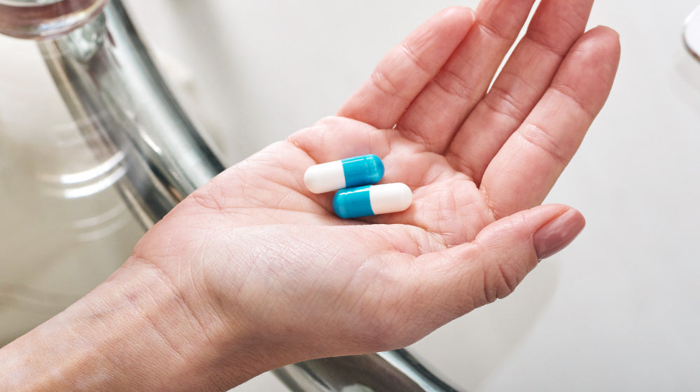 Some medication in a person's hand